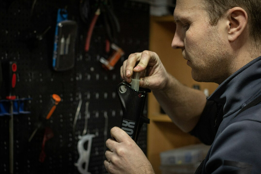 Mechanic inspecting a car in a workshop
