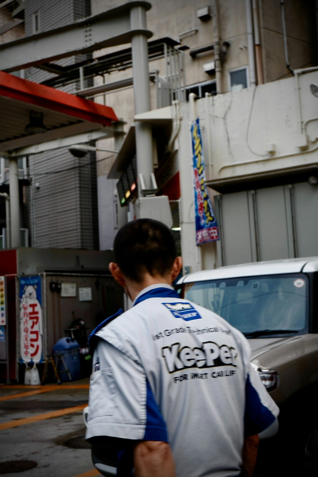 Technician working on a car in a garage